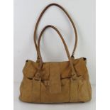 A sand coloured leather handbag by F&F Signature, approx 34cm wide.