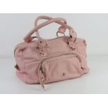 A baby pink leather handbag by Patrick Cox, some marks noted, approx 30cm wide.
