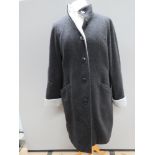 An 80% wool ladies coat in black with grey border, size 12, approx measurements; 40" chest size, 37.