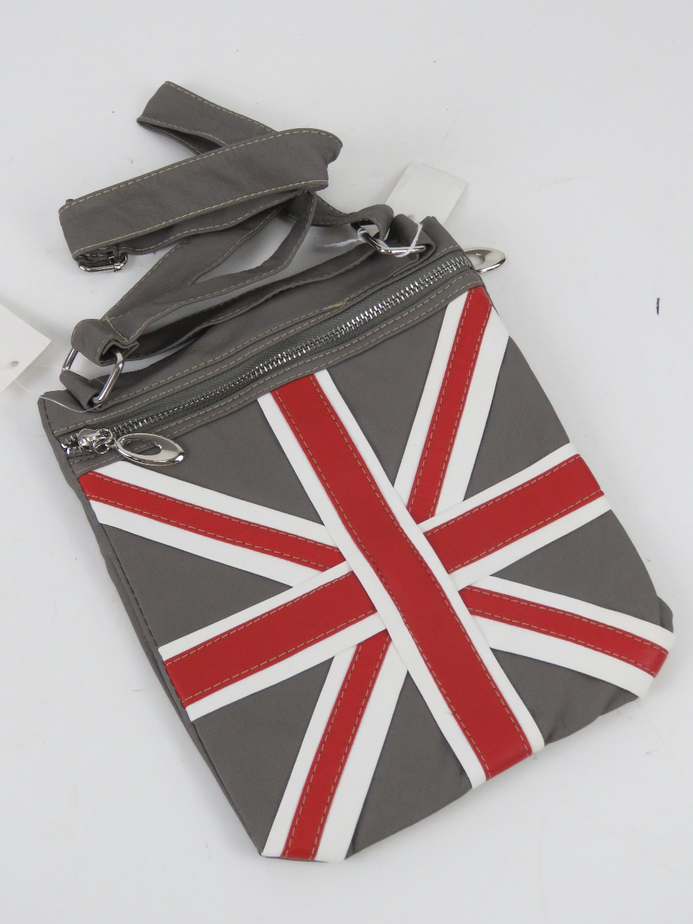 A Union Jack pattern cross body bag 'as new' in grey 21 x 25cm.
