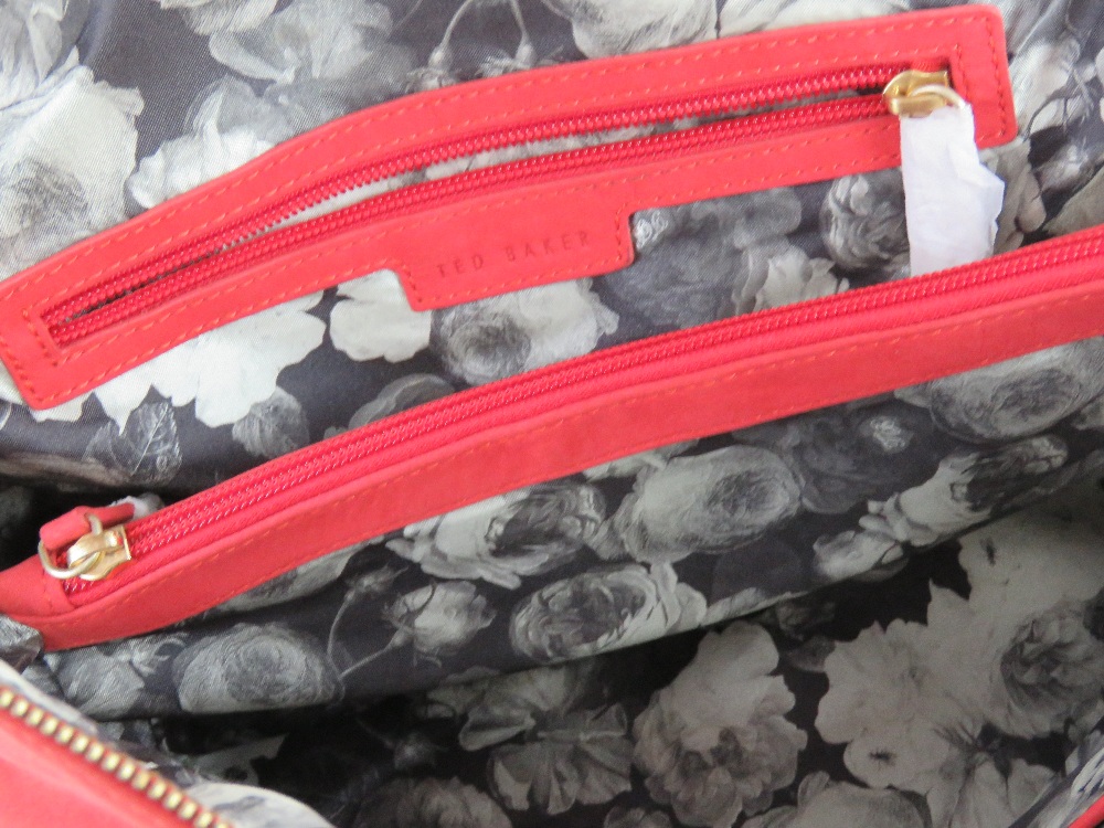 Ted Baker; a coral suede handbag having floral lining, approx 30cm wide. - Image 3 of 3