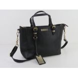 A black handbag by Carvella Kurt Geiger 26cm wide.