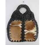 A vintage cow hide and leather handbag approx 32cm wide.