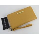 A yellow Steve Madden wallet having original labels upon RRP $48.