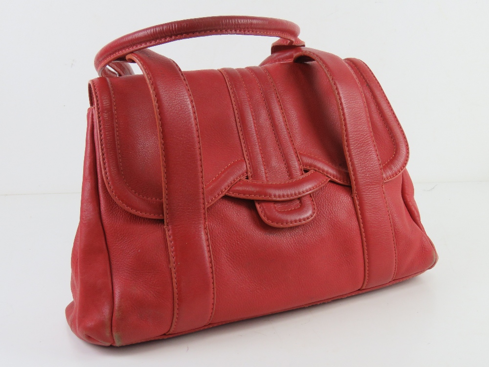 Radley; a red leather handbag, wear noted to corners, approx 35cm wide.