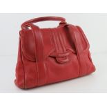 Radley; a red leather handbag, wear noted to corners, approx 35cm wide.