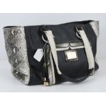 A handbag by Lipsy in black with 'python skin' detail 36 x 26cm.