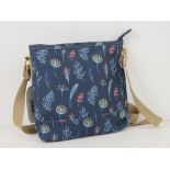 An 'as new' cross body bag in navy floral pattern by Nicole Brown 22 x 22cm.