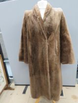 A vintage fur coat, approx measurements; 40" chest, 46" length to back, 18" underarm sleeve.