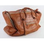 A vintage tan leather weekend bag approx 56cm in length.