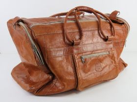 A vintage tan leather weekend bag approx 56cm in length.
