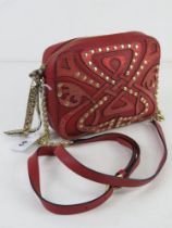 A vintage shoulder bag by Biba in red leather approx 18cm wide.