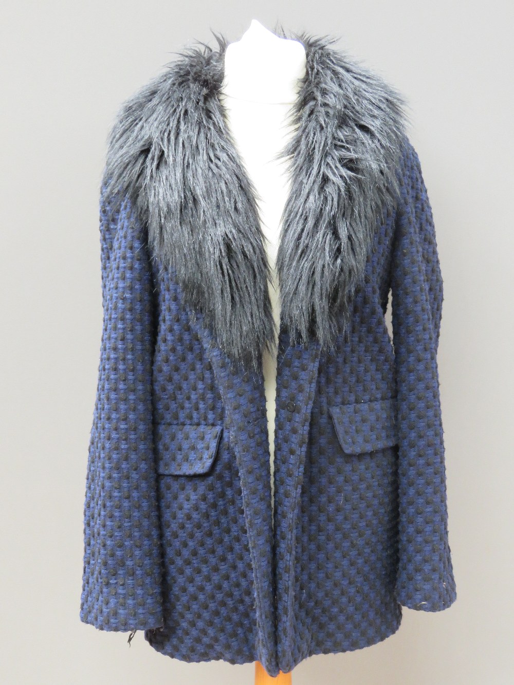 A ladies jacket in navy and black with faux fur collar, 10% wool, size 14.