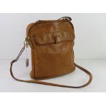 A tan leather shoulder bag by Tula, approx 27cm wide.
