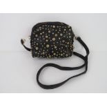 A black handbag with stud decoration 'as new', approx 20 x 17cm.