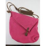 A hot pink canvas and suede cross body bag approx 34cm wide.