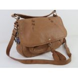 A tan leather handbag by Radley approx 33cm wide.