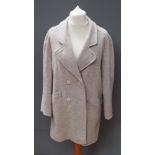 A pure new wool cream and beige coat, approx measurements 42" chest, 36" length to back, 15.