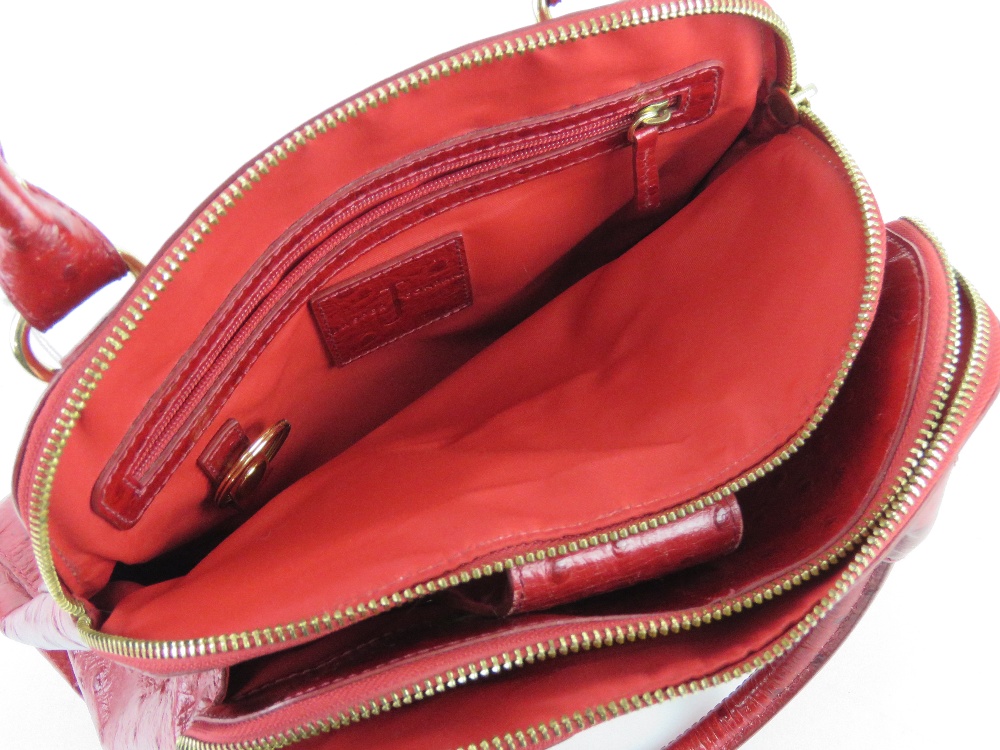 Jasper Conran; a red leather handbag having three sectional compartment approx 37cm wide. - Image 5 of 5