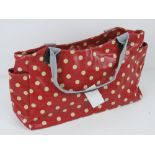 An 'as new' red polka dot handbag 49 x 23cm.