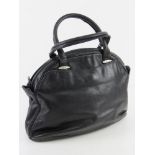 An Italian made vintage navy leather handbag approx 31cm wide.