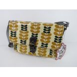A leaf patterned handbag in yellow 'as new', approx 31 x 20cm.