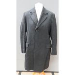 A pure new wool felted coat made by Crombie Aberdeen, Scotland in black,