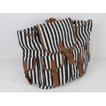 An 'as new' ruck sack in black and white striped pattern approx 33 x 34cm.