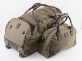 A green and brown wheeled weekend bag with matching handbag by Tripp, holdall approx 59 x 28cm,