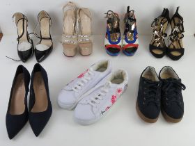 A quantity of assorted shoes inc platform, stiletto heels and trainers.