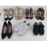 A quantity of assorted shoes inc platform, stiletto heels and trainers.