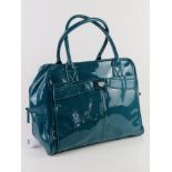 A turquoise patent overnight bag by Storm London approx 37cm wide.
