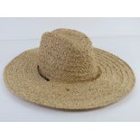 A hand made natural fibre sun hat by Scala size S/M.
