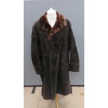 A suede coat by Hornes having acrylic fur lining, approx measurements 46" chest, 44" length to back,