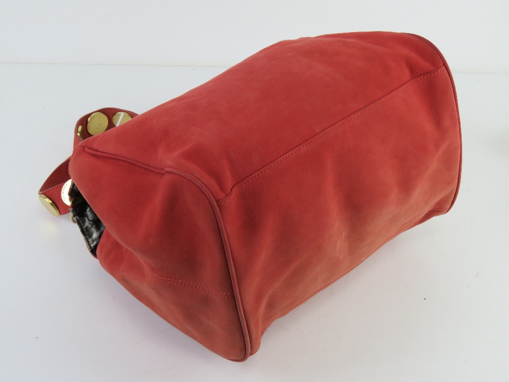 Ted Baker; a coral suede handbag having floral lining, approx 30cm wide. - Image 2 of 3