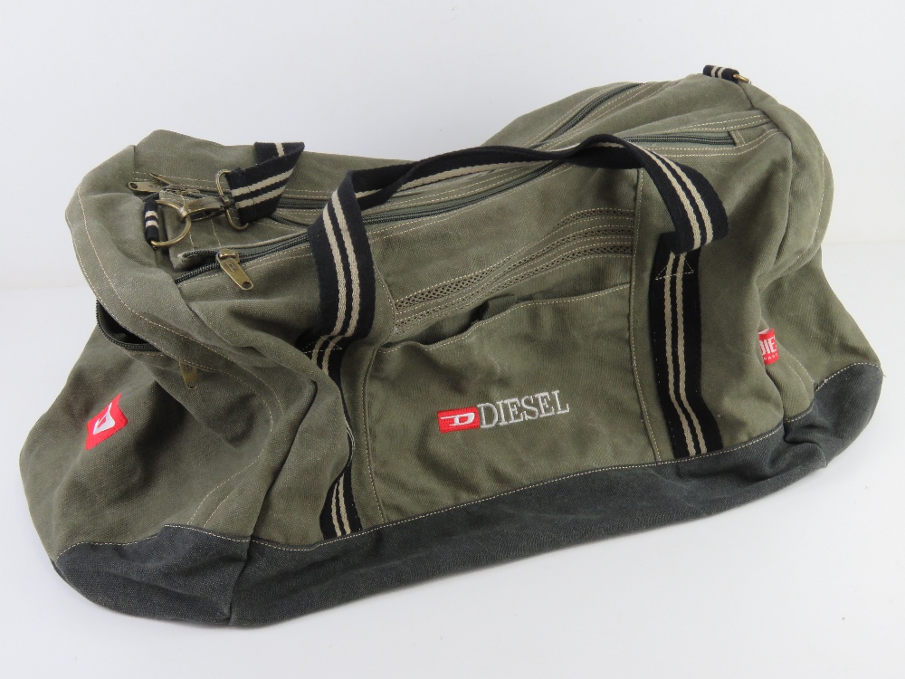 Diesel; a canvas holdall approx 66cm in length.