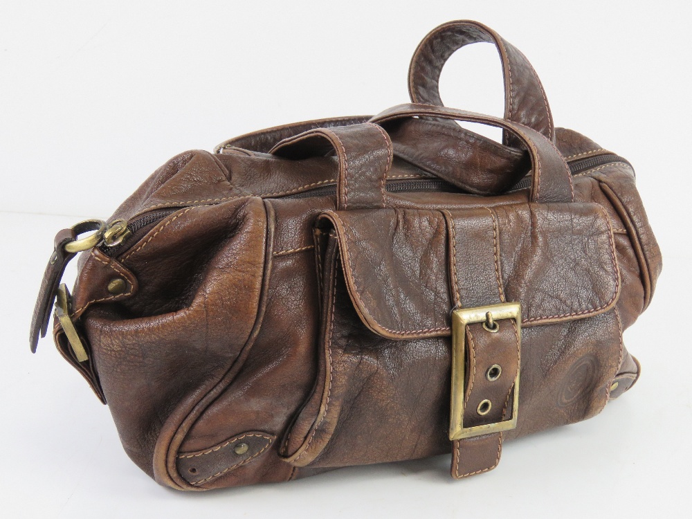 A brown leather handbag by Smith & Conova approx 30cm wide.