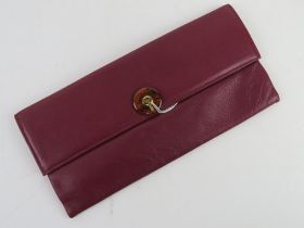A vintage Jane Shilton purple leather clutch bag having original invoice for Howell's of Cardiff