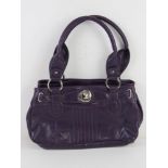 A purple leather handbag by Clarks, approx 30cm wide.