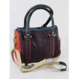 A small multicoloured handbag by Gringo approx 23cm wide. Slight damaged noted to shoulder strap.