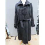 A vintage faux Black Persian wool coat by Jeune Elite, size 40, approx measurements; 47.