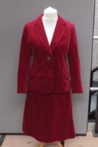 Vintage 1970's red velvet skirt suit by Maurice Henri. Wide notched lapels and twin waist pockets.