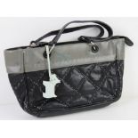 A black and grey Radley handbag approx 23cm wide.