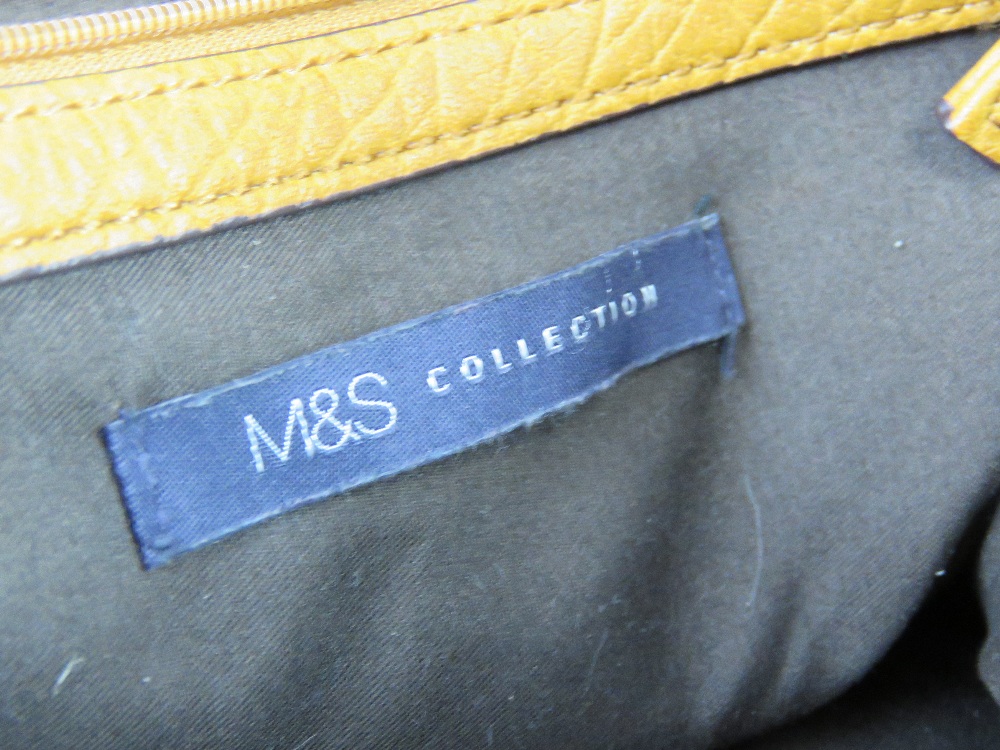 A mustard coloured cross body bag by M&S, slight wear noted to corners, approx 33cm wide. - Image 4 of 5