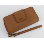 A brown leather purse/wallet by Fossil, approx 17cm wide.