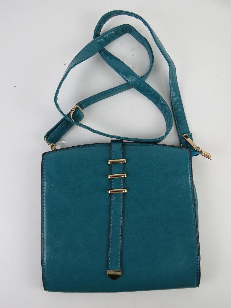 A turquoise shoulder bag by Bella approx 22cm wide.
