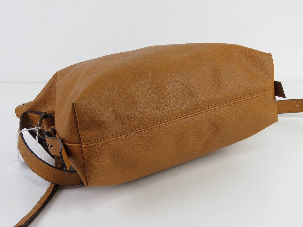 A mustard coloured cross body bag by M&S, slight wear noted to corners, approx 33cm wide. - Image 3 of 5
