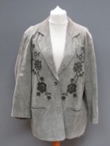 A green suede jacket having floral pattern upon by Beth Terrell, approx measurements; 48" chest,