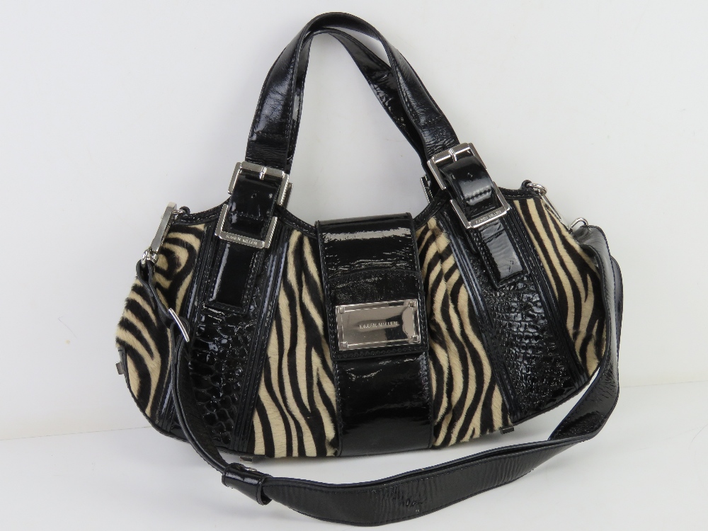Karen Millen; faux zebra skin and black patent handbag approx 40cm wide.