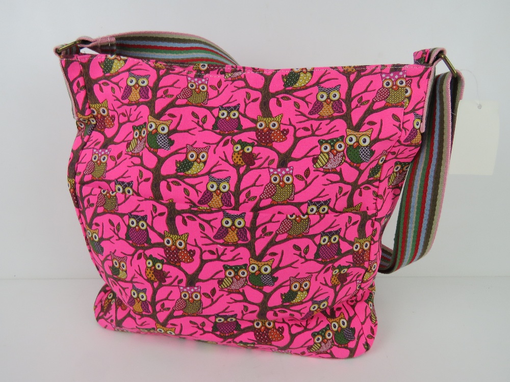 A fabric tote bag having owl pattern in neon pink 'as new', approx 38 x 34cm.